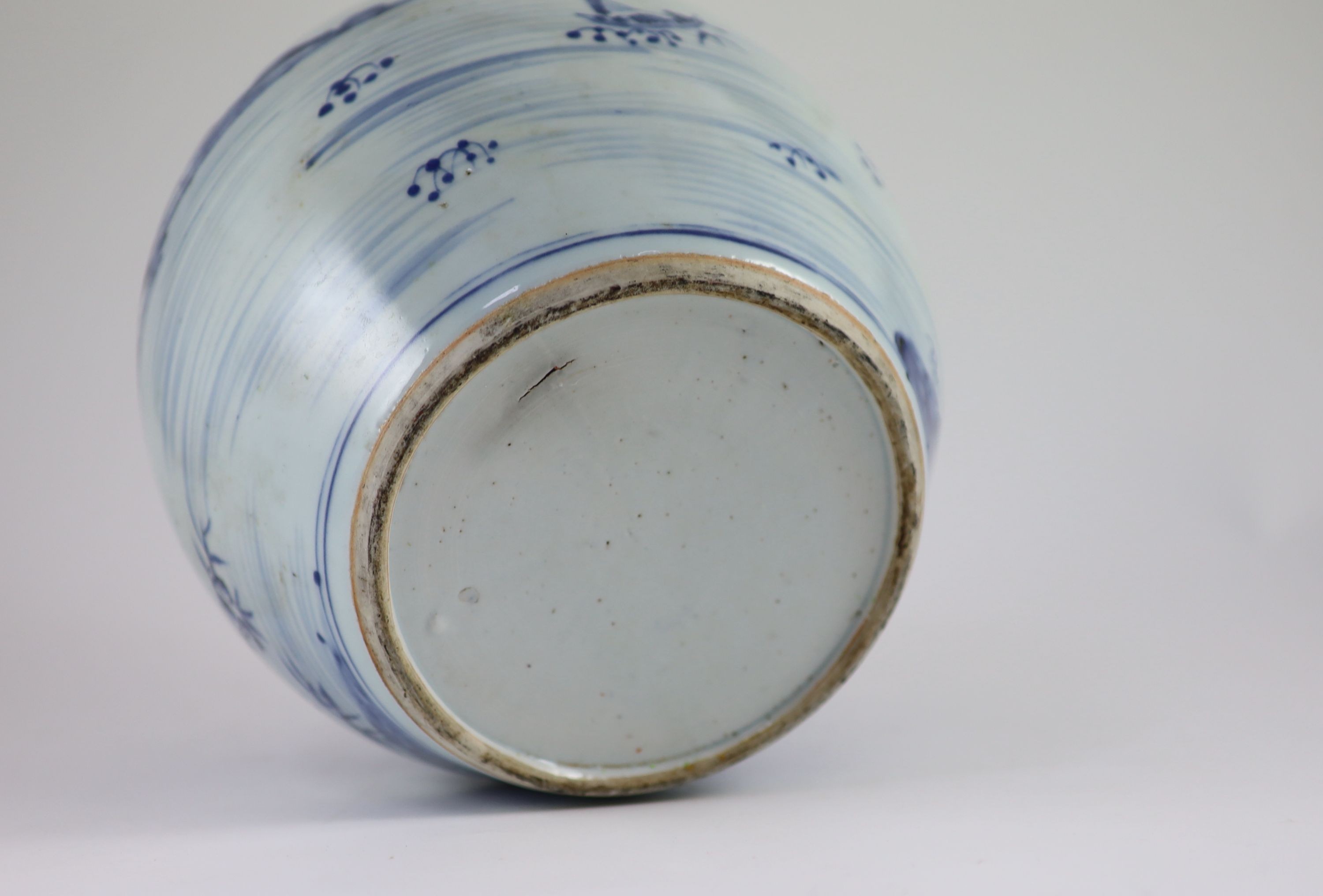 A Chinese blue and white jar and cover, Kangxi period (1662-1722), 23cm high, metal fittings attached to shoulder, Cover repaired and not the best fit